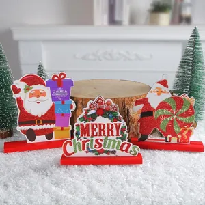 Set of three wooden Santa Claus tabletop ornaments with Merry Christmas greeting signs