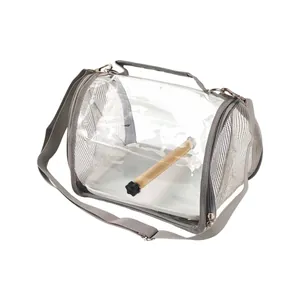 Detailed view of the portable bird carrier bag with mesh sides and a wooden perch