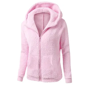 Detailed macro view showing the soft plush texture of this pink hooded zip-up jacket for women