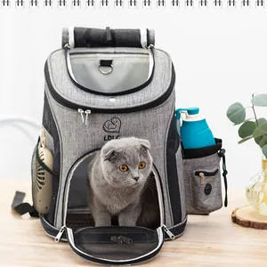 Breathable gray pet backpack with cat inside, featuring side pockets and portable design