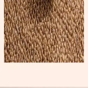 Close-up view of the durable woven fiber texture of a brown cat scratching carpet mat.