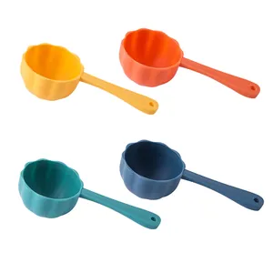 Set of four colorful flower-shaped pet food scoops for measuring dog and cat kibble easily.