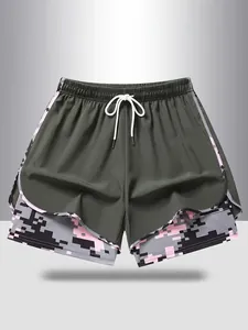 Detail of women's 2-in-1 sports shorts with pink camouflage lining and white drawstring