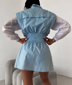 Back view of a casual blue and white color block sports suit with elastic waist detail