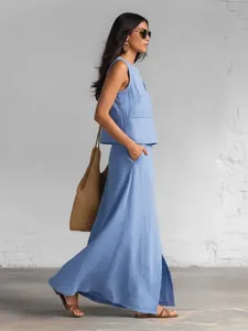 Side view showing details of light blue cotton linen sleeveless top and maxi skirt set