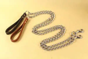 Close-up of heavy-duty metal dog leashes with premium brown leather handles