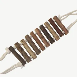 Macro detail of a flexible natural wood ladder bridge for small parrot bird cages