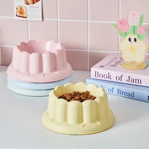 Scalloped pastel colored pet food bowls for cats and dogs, large capacity and anti-tip design.