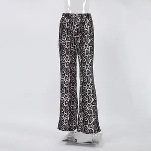 Detailed view of fashionable leopard print high-waisted wide-leg pants on mannequin