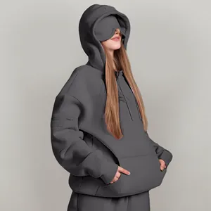 Oversized dark grey hoodie featuring a unique built-in sleep mask for travel and relaxation