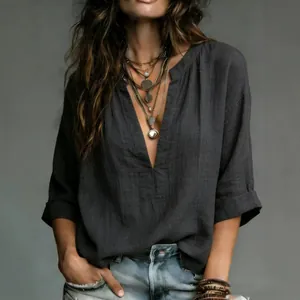 Elegant casual dark grey V-neck blouse for women with relaxed fit and bohemian styling