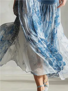 Detail view of the vintage blue print chiffon midi skirt fabric with denim patchwork