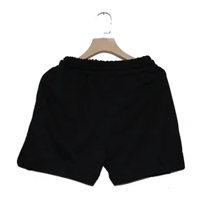 Back view of black quick-dry athletic sports shorts for men featuring an elastic waistband