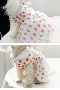 Close-up detail of cute strawberry print pet dress featuring white collar and metal D-ring