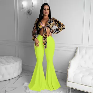 Sexy two-piece set featuring baroque print tie-front crop top and lime green flare pants