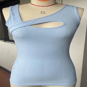 Detail view of a light blue ribbed sleeveless top featuring a stylish chest cutout design