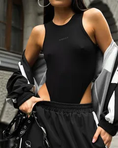 Close-up of stylish women's black high-cut bodysuit with sporty color-block track suit