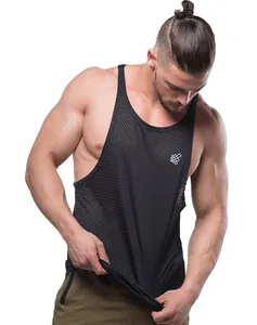 Close-up of model wearing a black breathable mesh gym tank top with a stringer fit
