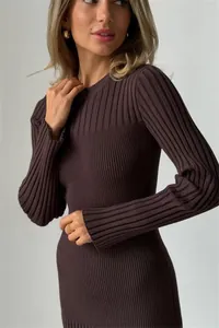 Detailed texture view of a brown ribbed knit dress with long sleeves and crew neck