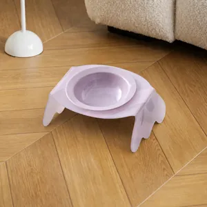 Ergonomic tilted lavender ceramic pet bowl with clear purple acrylic stand on wood floor
