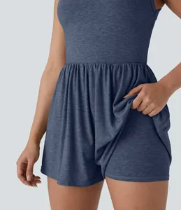 Detailed view of women's sleeveless athletic romper showing built-in shorts feature