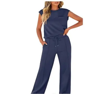 Close-up view of navy blue sleeveless top and high-waist wide-leg pants casual set