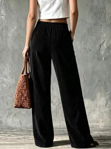 Back view of vintage black corduroy wide-leg trousers for women with a stylish look