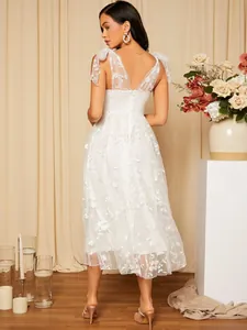 Elegant white lace camisole formal dress with V-neck and floral embroidery detail