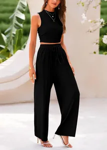 Elegant black two-piece knit set featuring a sleeveless crop top and flowy wide-leg trousers