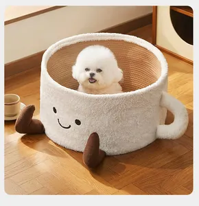 Comfortable white cup-shaped plush pet bed with smiling face detail on a wooden floor