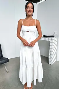 Elegant white tiered spaghetti strap maxi dress featuring a chic cutout waist design