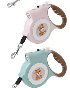 Detail of pink and blue automatic retractable dog leashes with built-in LED lights