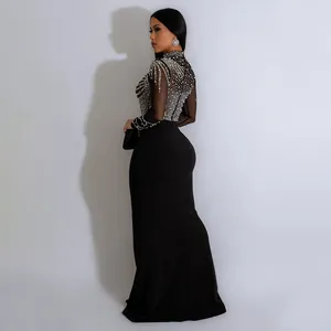 Elegant black evening gown featuring rhinestone mesh top and long sleeves for party wear