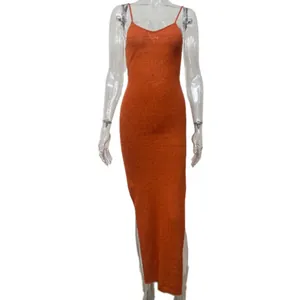 Front view of a sexy orange knitted slip dress with high side slit for summer vacation