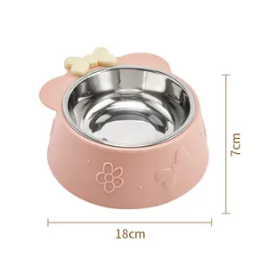 Pink pet bowl with bow decoration and stainless steel inner bowl, 18cm base diameter.