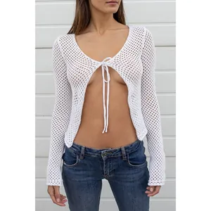 Elegant white long sleeve hollow-out knitted cardigan featuring a stylish front bow tie