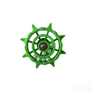 Detailed view of green plastic ship's wheel parrot toy with rotating white beads