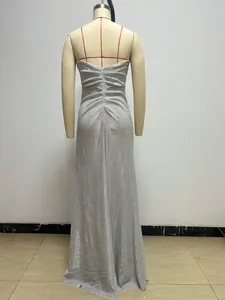 Detail back view of elegant silver glitter maxi evening gown shown on mannequin