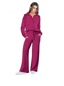 Women's fashion fuchsia two-piece tracksuit featuring half-zip sweatshirt and wide-leg pants