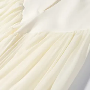 Close-up of cream pleated fabric detail on elegant summer blazer suit set