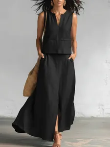Detailed view of elegant black cotton linen two-piece set with V-neck top and long skirt