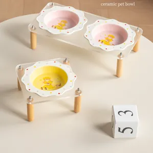 Modern floral ceramic pet bowl set with transparent acrylic stand and wooden legs.