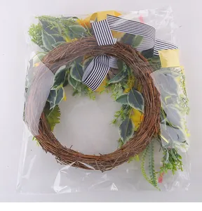 Artificial sunflower wreath detailed view inside clear plastic shipping bag packaging