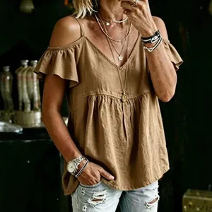 Close-up detail of women's brown cold-shoulder top featuring ruffle sleeves and a V-neckline