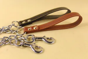 Detail view of heavy-duty metal chain dog leashes with premium leather-padded handles.