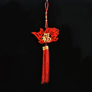 Traditional red Chinese New Year hanging decoration with felt fish and gold Fu charm