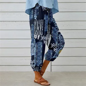 Close-up of bohemian style printed cotton linen harem pants with elastic ankle cuffs.