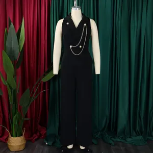 Close-up of sleeveless black wide-leg jumpsuit with metallic chain and suit collar