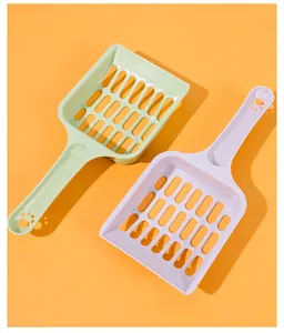 Detailed view of hollow grid design on macaron colored cat litter scoops