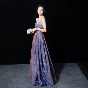 Elegant sparkly gradient V-neck evening gown with spaghetti straps and open back.
